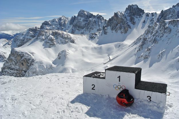 winner podium on a snowy mountain peak