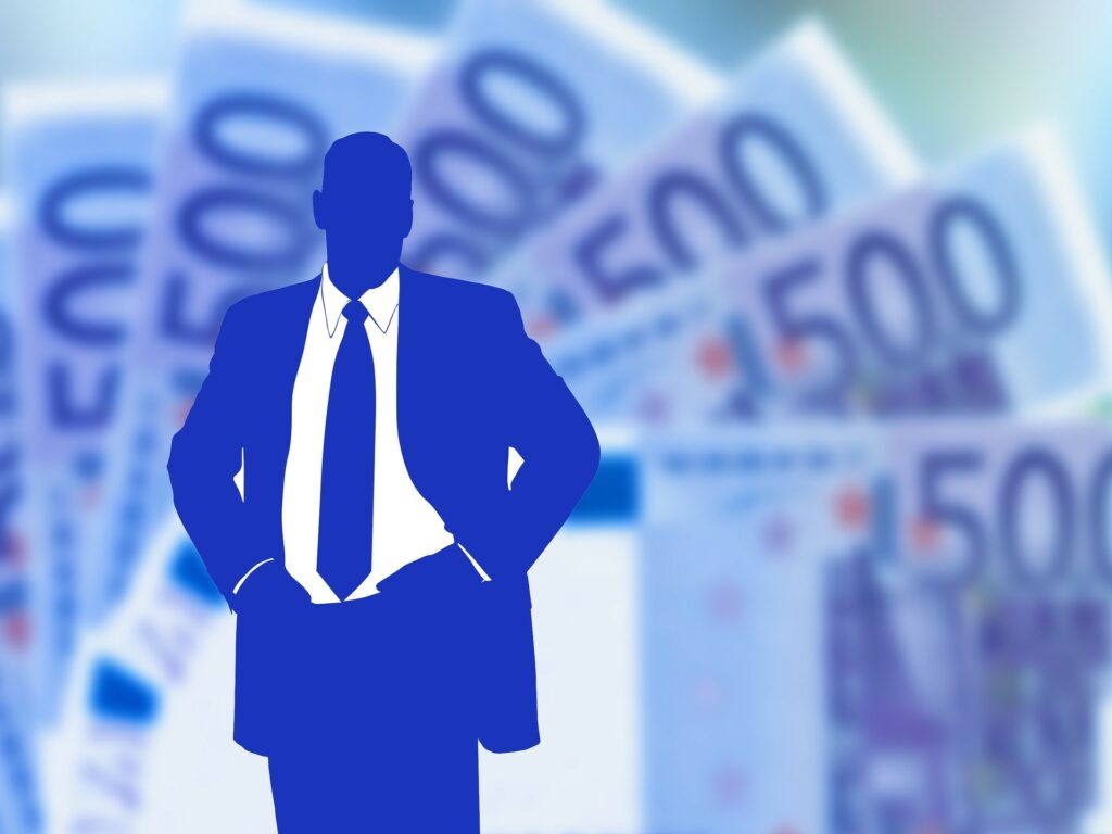 Blue silhouette of a businessman against 500 euro banknotes, illustrating
